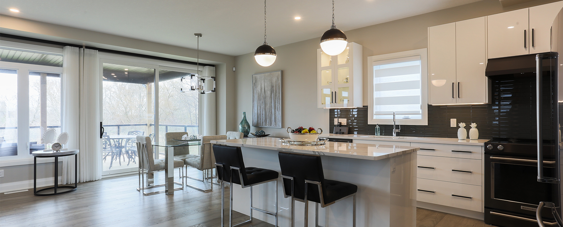 Open concept kitchen and patio at Meadowlily by Rembrandt Homes. A single family home community in south east London.