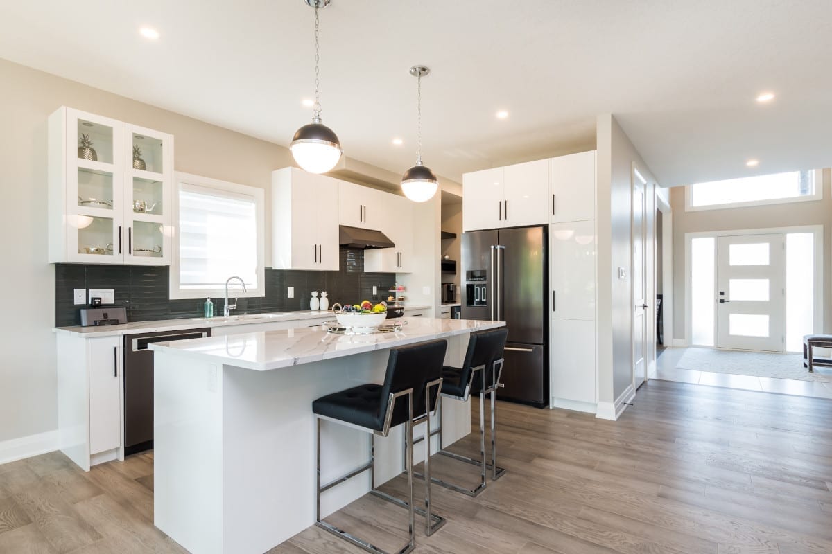 Large island offers casual seating and additional prep area.