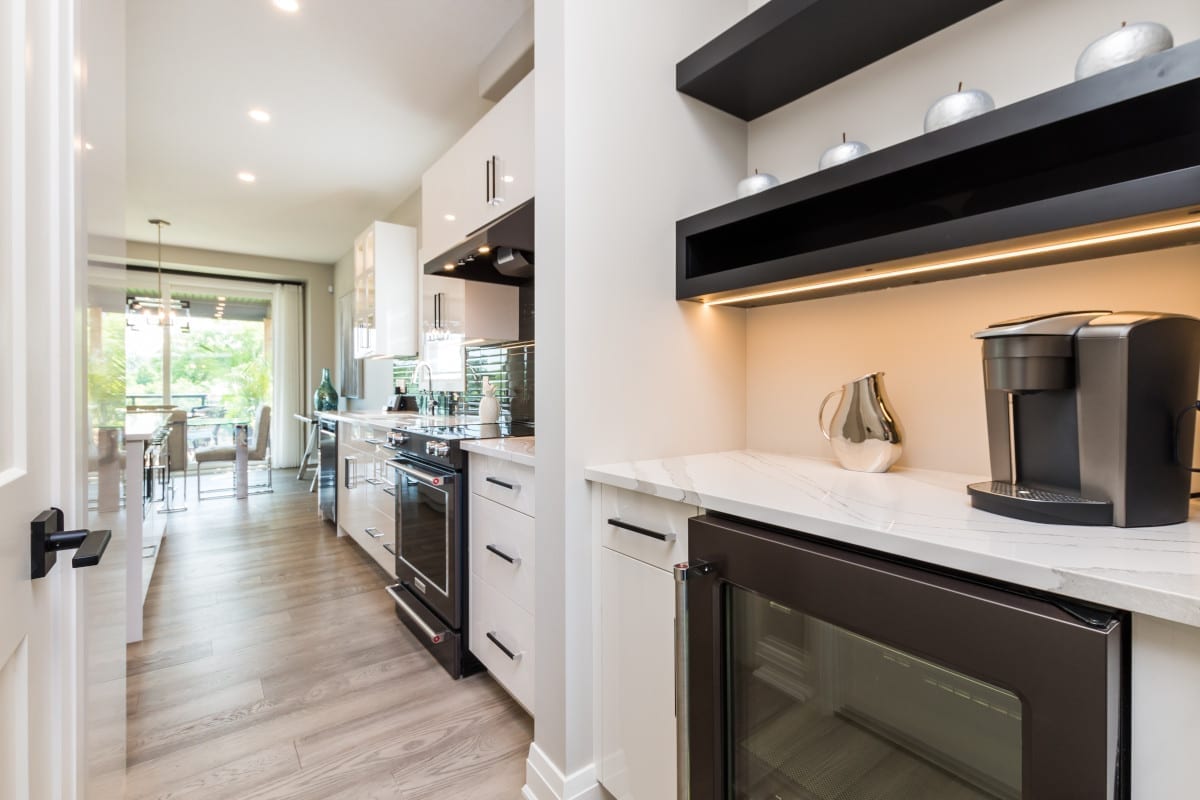 A conveniently tucked away Butlers Pantry, with a coffee station and extra bar fridge.