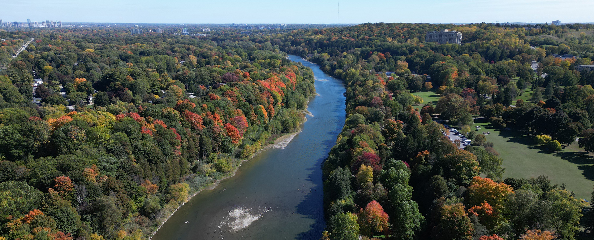 Three generations, enjoying a quiet moment, fishing from a dock.