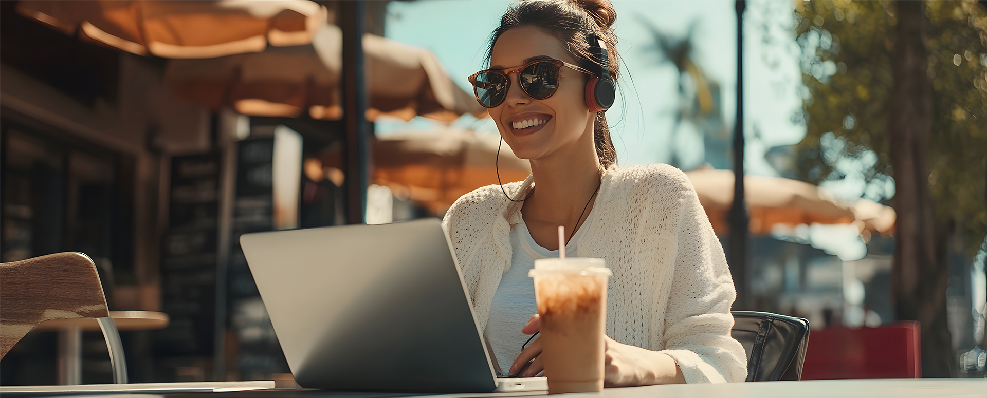 A woman enjoying an iced coffee.