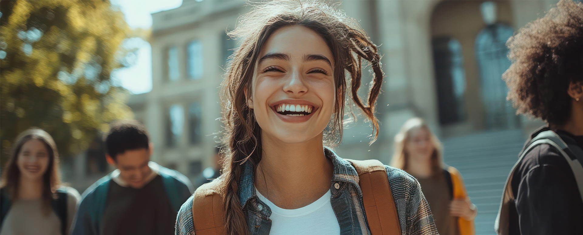 A group of students sitting on the grass on a sunny day. London is a regional centre for education, governed by four school boards for elementary and secondary school, and is home to the prestigious University of Western Ontario and Fanshawe College.