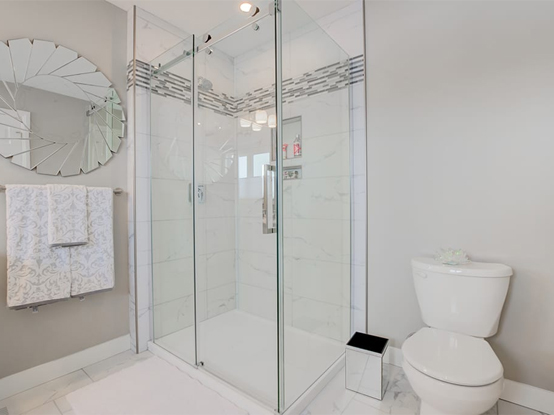Tiled Ensuite shower with horizontal tile accent.