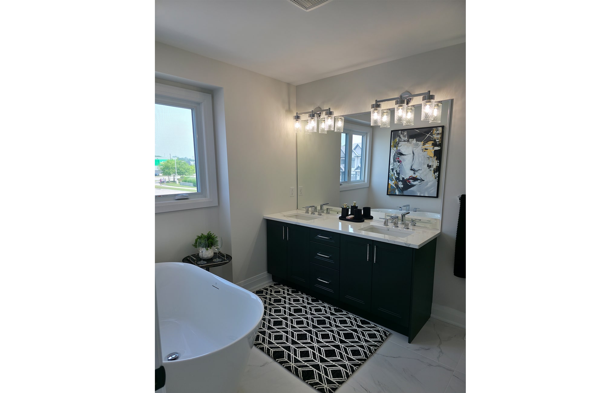 Primary Ensuite finished with dark green cabinetry and crisp white countertop with matching green veining.