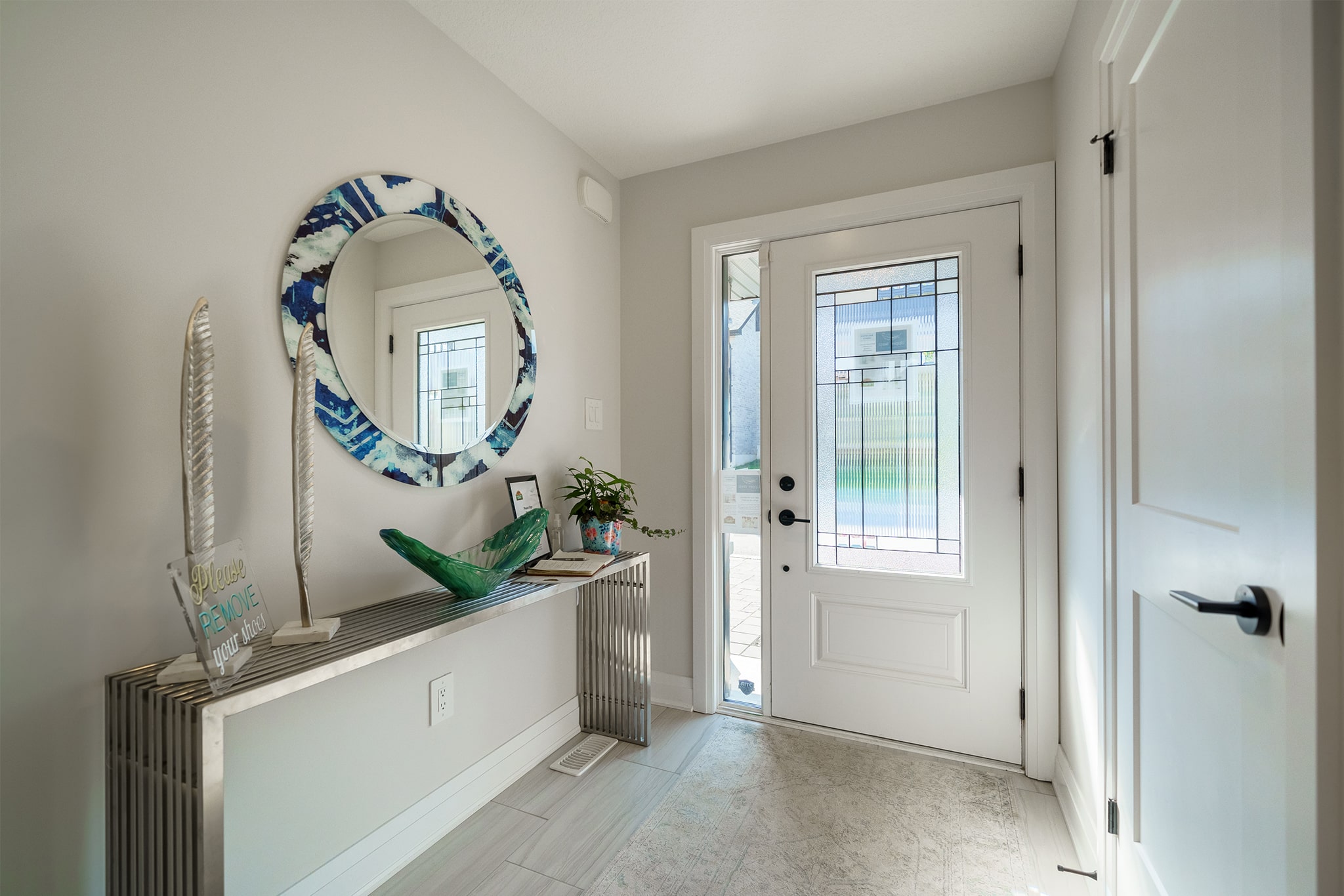 Bright, welcoming foyer of model home at Upper West.