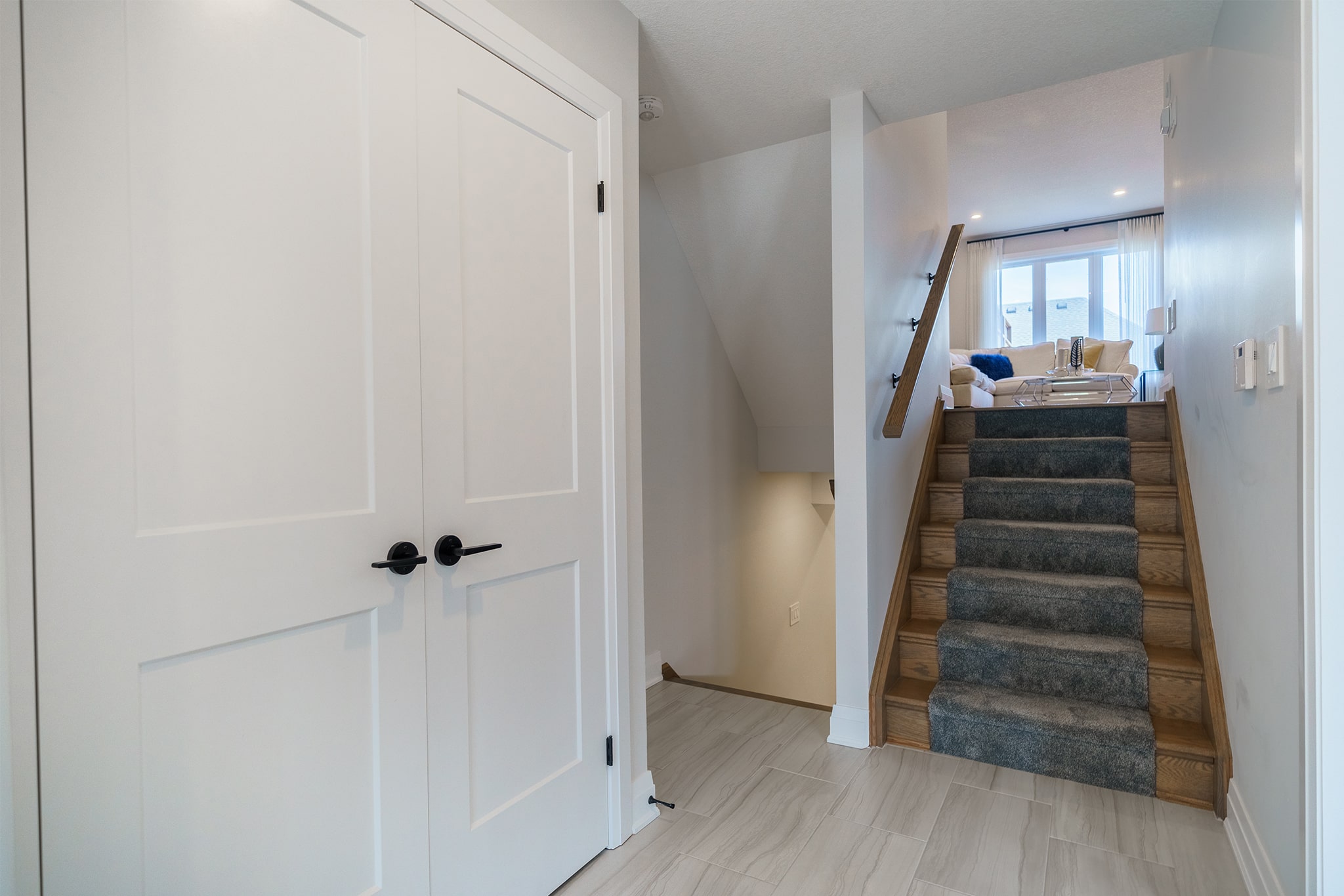 Stairs leading up to main level of the Westerdam model at Upper West.