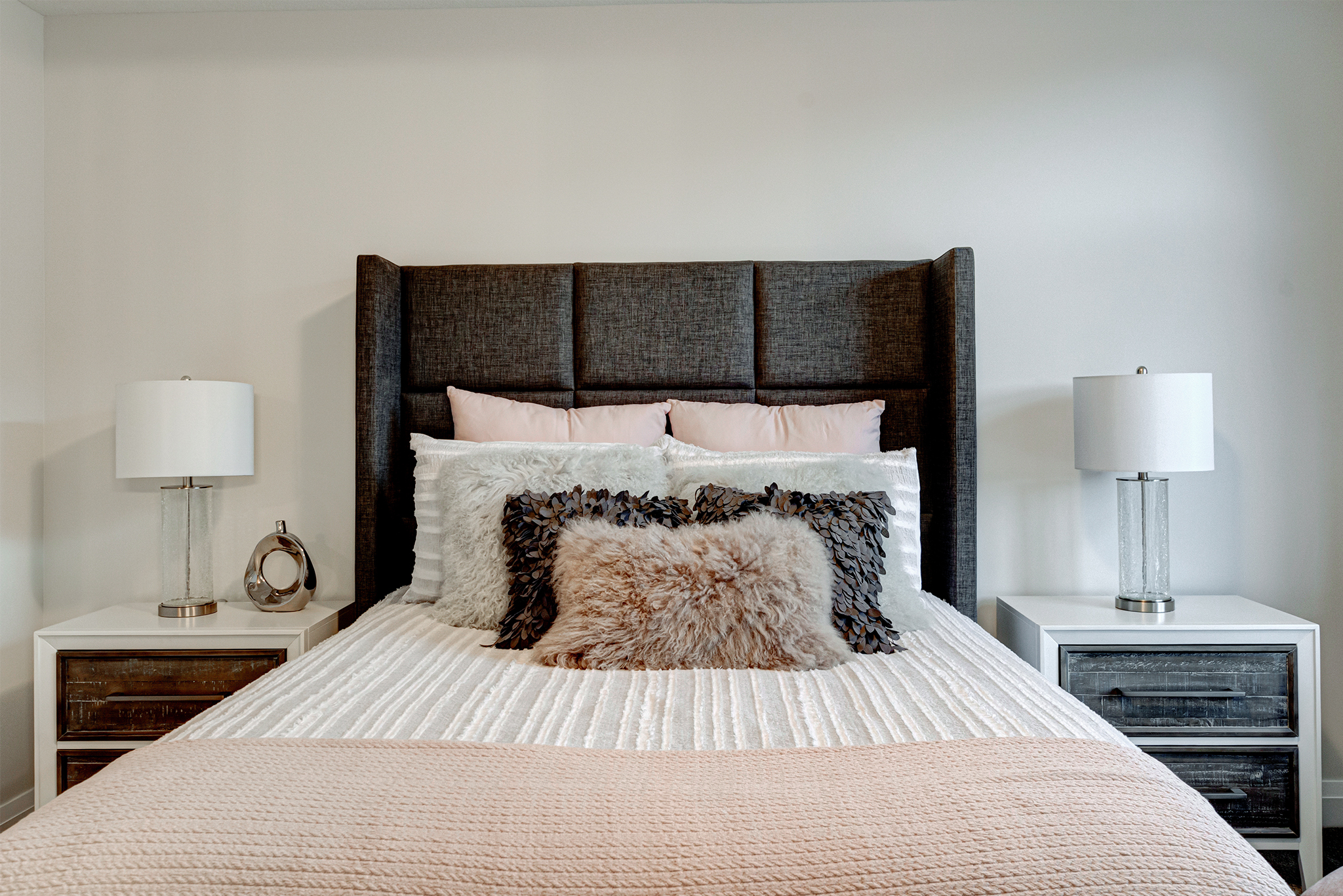 Luxurious primary bedroom suite at Upper West by Rembrandt Homes.